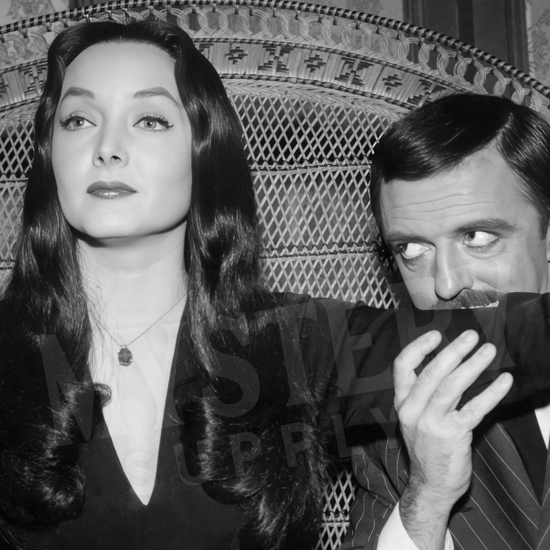 Morticia and Gomez 1960s Vintage Addams Family Black and White Photo Reproduction wall decor art print from Mystery Supply Co. @mysterysupplyco