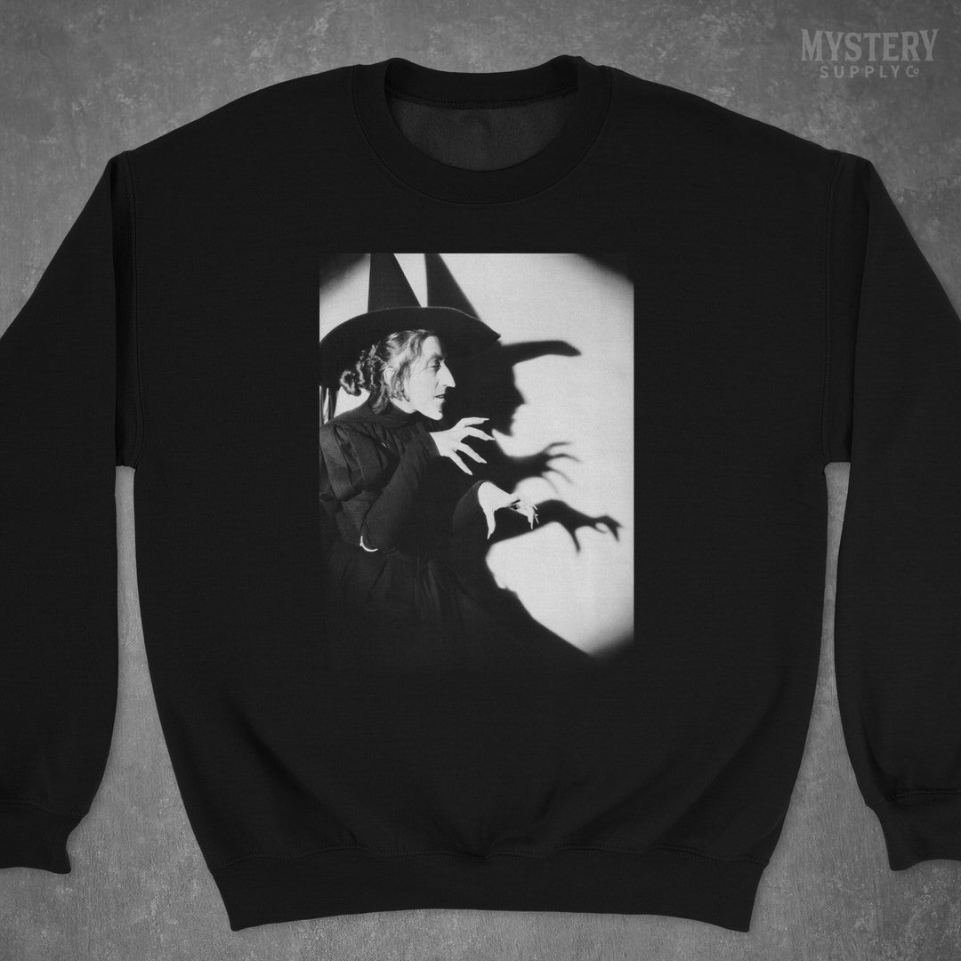 Wicked Witch of the West 1930s vintage profile with shadow Margaret Hamilton Wizard of Oz black and white movie photo Mens Womens Unisex Heavy Blend Crewneck Sweatshirt from Mystery Supply Co. @mysterysupplyco