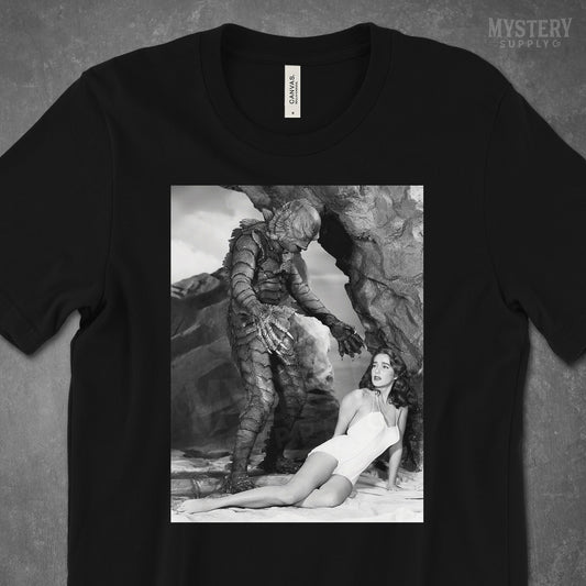 Creature from the Black Lagoon 1954 vintage horror monster Julie Adams swim suit and the gill man black and white photo Mens Womens Unisex T-Shirt from Mystery Supply Co. @mysterysupplyco