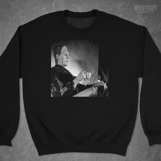 Frankenstein Vintage Boris Karloff Relaxing Smoking Drinking Tea Horror Movie Monster Black and White Photo reproduction Mens Womens Unisex Heavy Blend Crewneck Sweatshirt from Mystery Supply Co. @mysterysupplyco