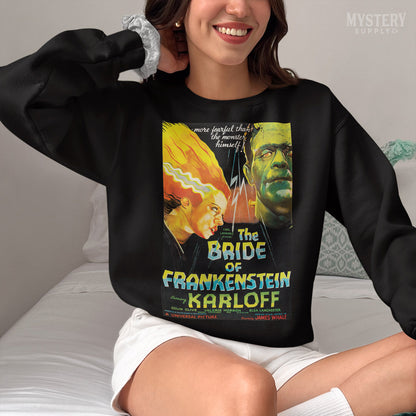 Woman wearing The Bride of Frankenstein 1935 vintage horror monster movie poster reproduction Mens Womens Unisex Heavy Blend Crewneck Sweatshirt from Mystery Supply Co. @mysterysupplyco