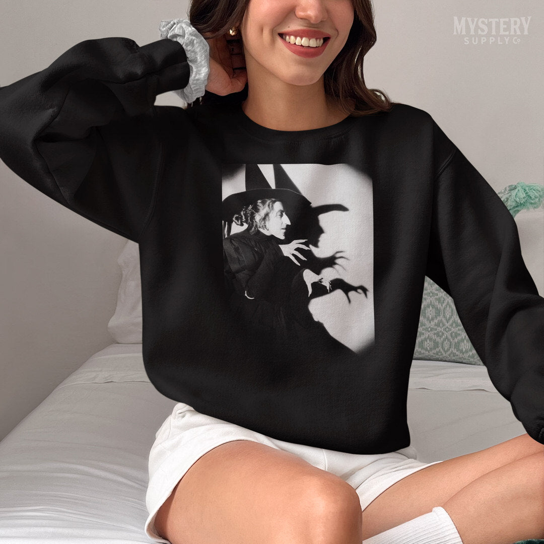 Wicked Witch of the West 1930s vintage profile with shadow Margaret Hamilton Wizard of Oz black and white movie photo Mens Womens Unisex Heavy Blend Crewneck Sweatshirt from Mystery Supply Co. @mysterysupplyco