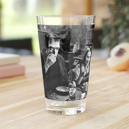 Herman and Lily Munster 1960s Vintage The Munsters Frankenstein Vampire Horror Monster Couple Black and White Photo reproduction 16oz pint glass home decor glassware from Mystery Supply Co. @mysterysupplyco