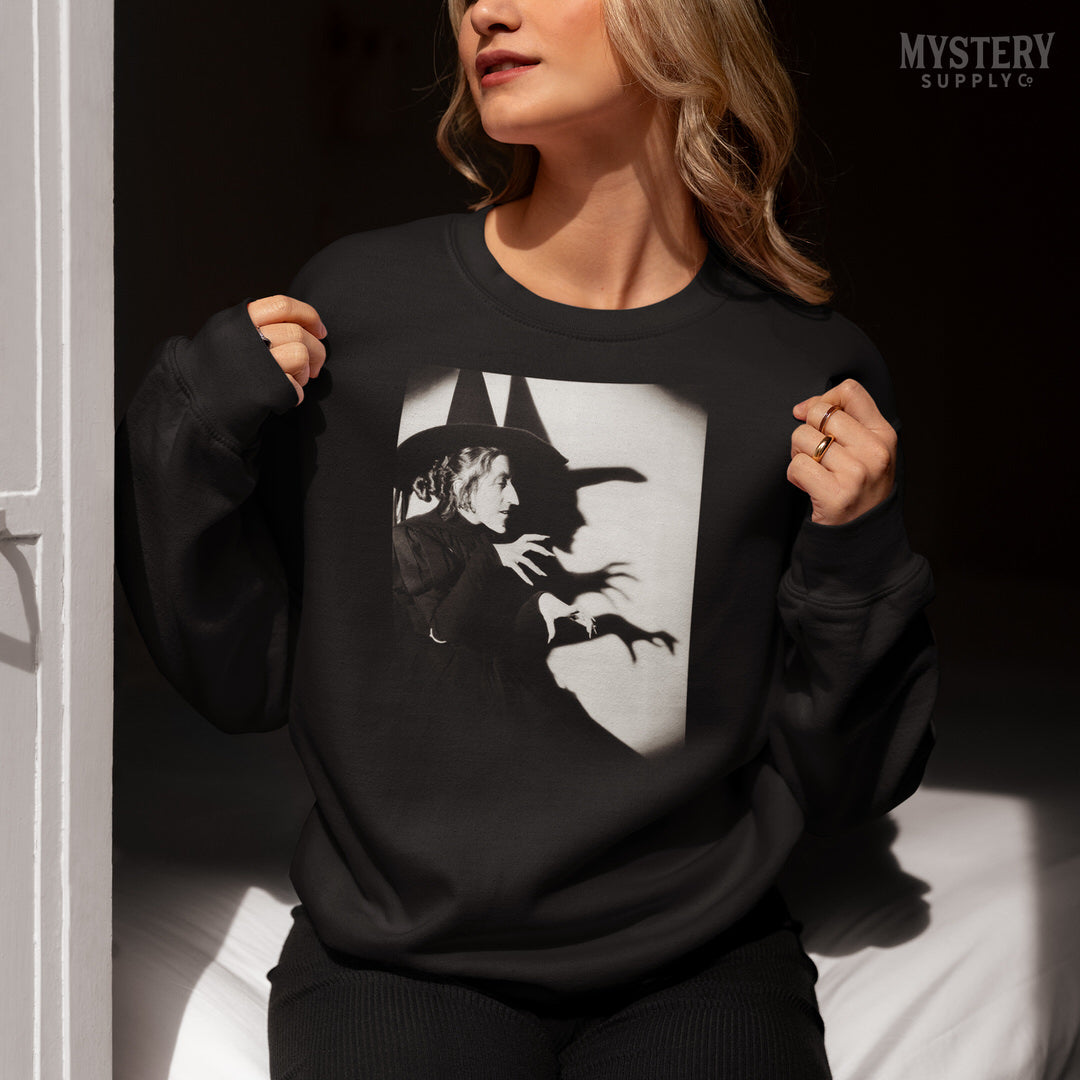 Wicked Witch of the West 1930s vintage profile with shadow Margaret Hamilton Wizard of Oz black and white movie photo Mens Womens Unisex Heavy Blend Crewneck Sweatshirt from Mystery Supply Co. @mysterysupplyco