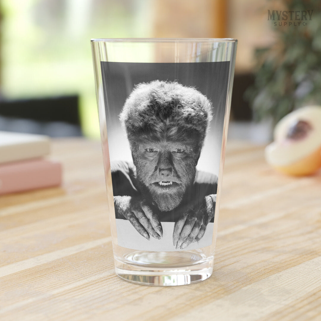 The Wolf Man 1941 Vintage Horror Movie Monster Lon Chaney Jr. Werewolf fangs and claws Black and White photo reproduction 16oz clear pint glass home decor glassware from Mystery Supply Co. @mysterysupplyco