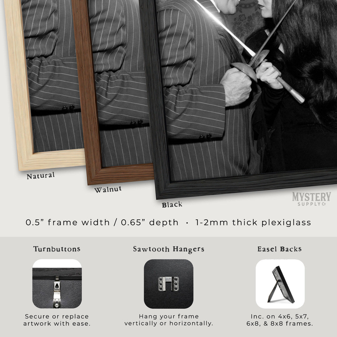 Morticia and Gomez Fencing 1960s Vintage Addams Family Black and White Photo Reproduction wall decor art print from Mystery Supply Co. @mysterysupplyco