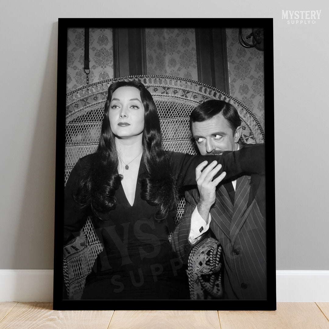 Morticia and Gomez 1960s Vintage Addams Family Black and White Photo Reproduction wall decor art print from Mystery Supply Co. @mysterysupplyco