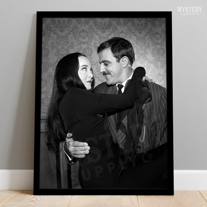 Gomez holding Morticia Addams 1960s vintage Addams family black and white photo reproduction wall decor art print from Mystery Supply Co. @mysterysupplyco