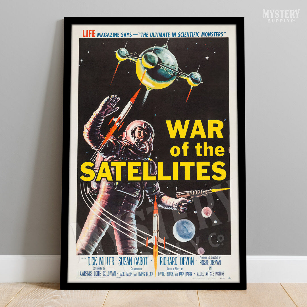 Framed movie poster for 'War of the Satellites' with an astronaut and satellite imagery. From Mystery Supply Co. @mysterysupplyco