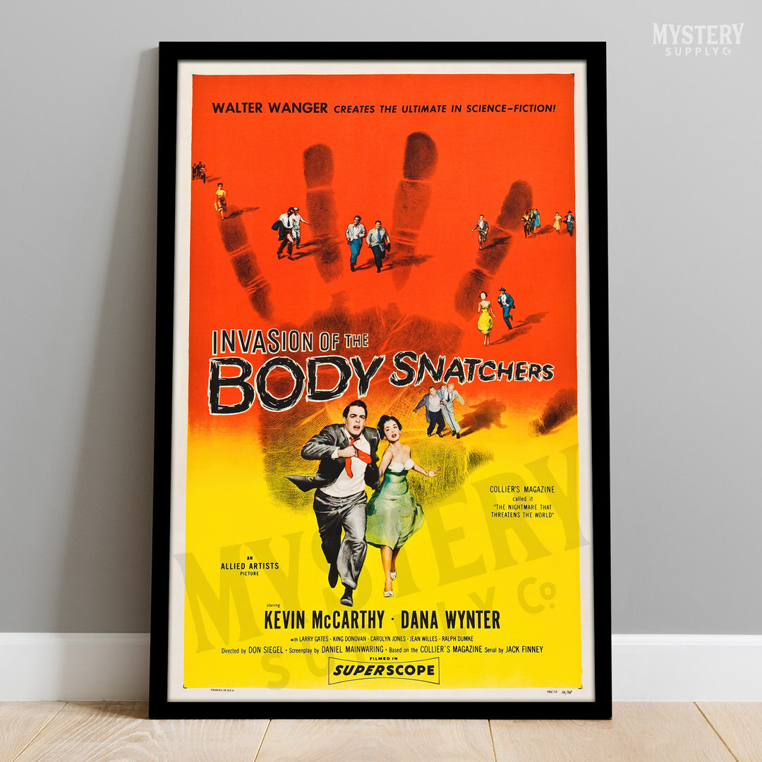 Vintage movie poster for 'Invasion of the Body Snatchers' on a gray wall. Invasion of the Body Snatchers 1956 Horror Movie Poster wall decor art print from Mystery Supply Co. @mysterysupplyco