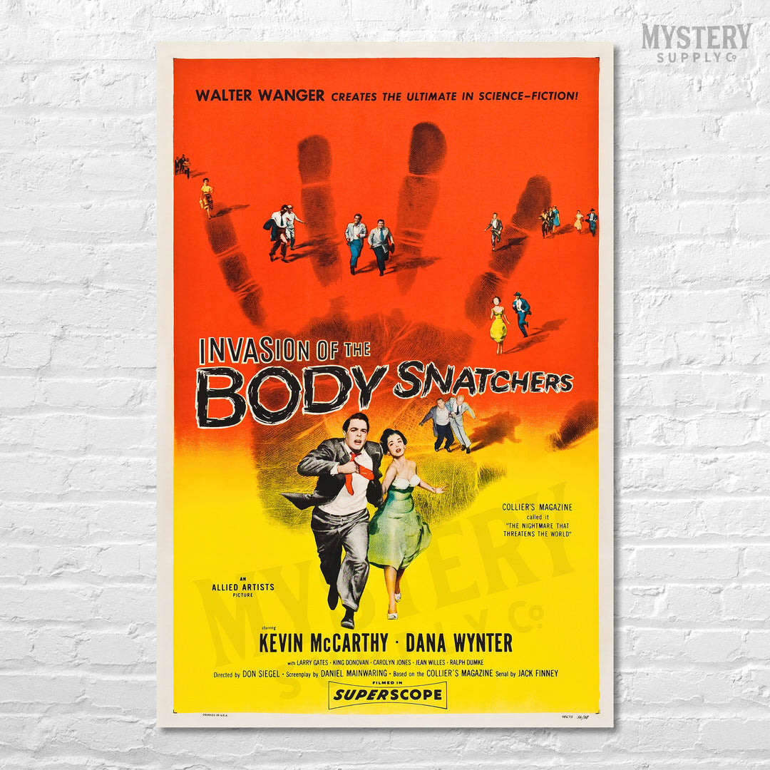 Vintage movie poster for 'Invasion of the Body Snatchers' on a white brick wall. From Mystery Supply Co. @mysterysupplyco