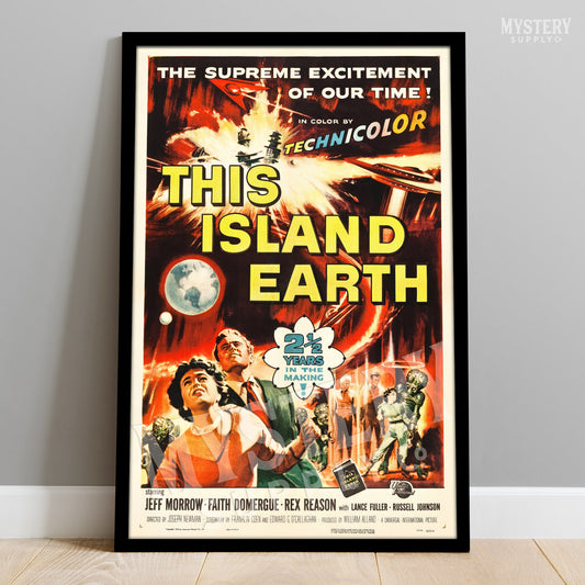 Vintage movie poster for 'This Island Earth' with vibrant colors and text on a plain wall. From Mystery Supply Co. @mysterysupplyco