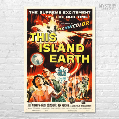 Vintage movie poster for 'This Island Earth' on a white brick wall. From Mystery Supply Co. @mysterysupplyco