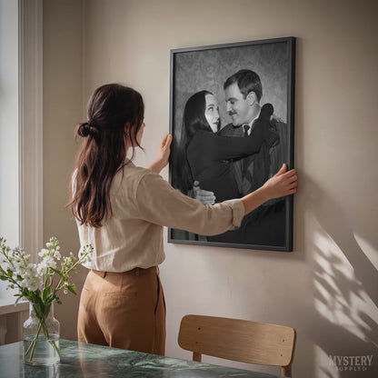 Gomez holding Morticia Addams 1960s vintage Addams family black and white photo reproduction wall decor art print from Mystery Supply Co. @mysterysupplyco