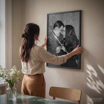 Morticia and Gomez Fencing 1960s Vintage Addams Family Black and White Photo Reproduction wall decor art print from Mystery Supply Co. @mysterysupplyco
