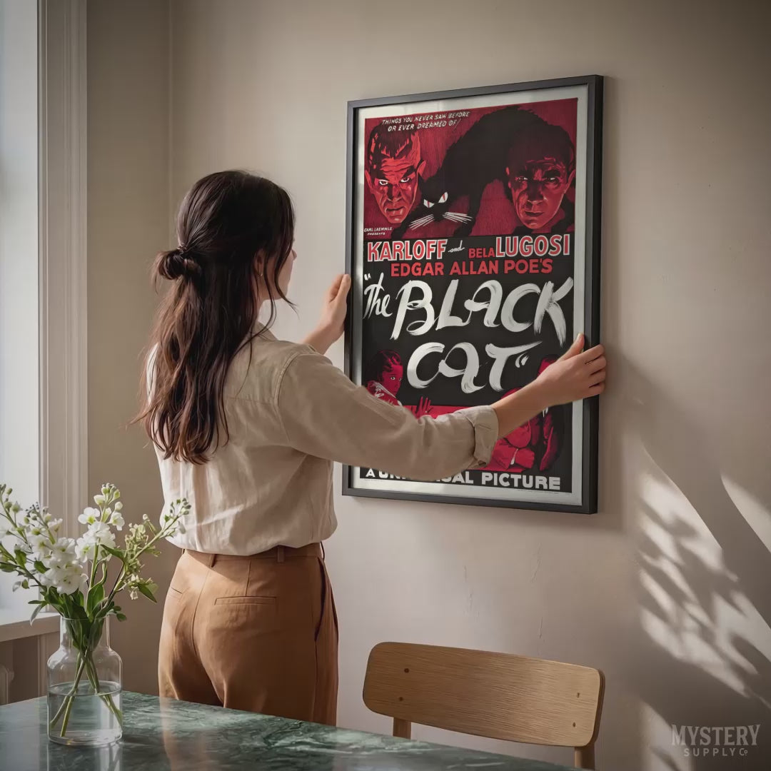 Vintage movie poster for 'The Black Cat' with classic horror imagery, framed on a wall.  From Mystery Supply Co.